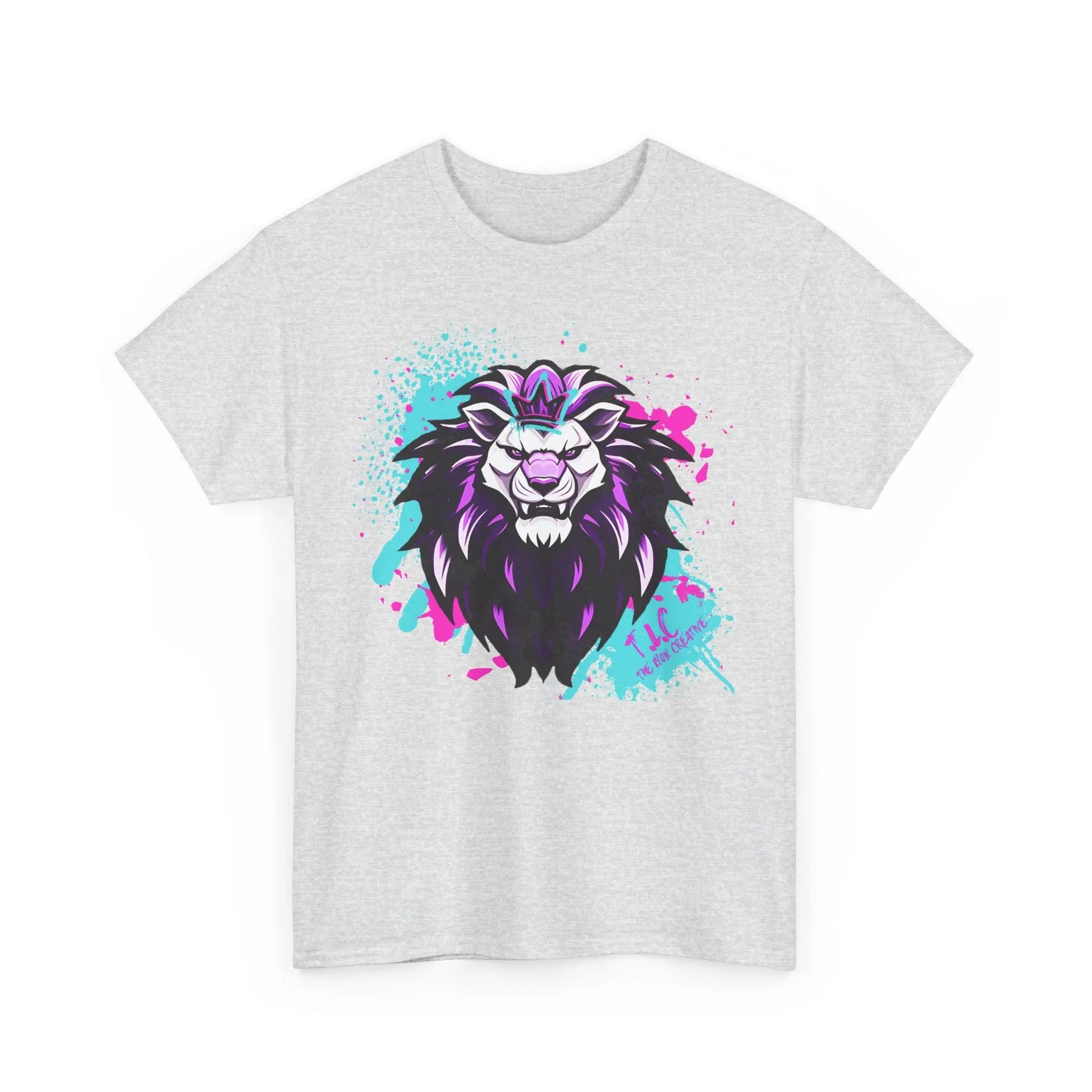 The Lyon T-shirt, made from 100% cotton, features a stylized lion's head illustration in purple, black, and white on a gray fabric. The background pops with vibrant splashes of pink and turquoise paint. It offers a classic fit that combines style with sustainable production practices.