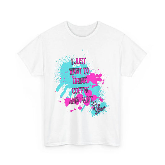 The "I Just Want to Drink Coffee T-shirt" is made from 100% cotton and features vivid pink and teal paint splatters. The stylish design includes purple and blue text that says, "I Just Want to Drink Coffee and Paint," offering a classic fit with sustainable production for an eco-friendly choice.