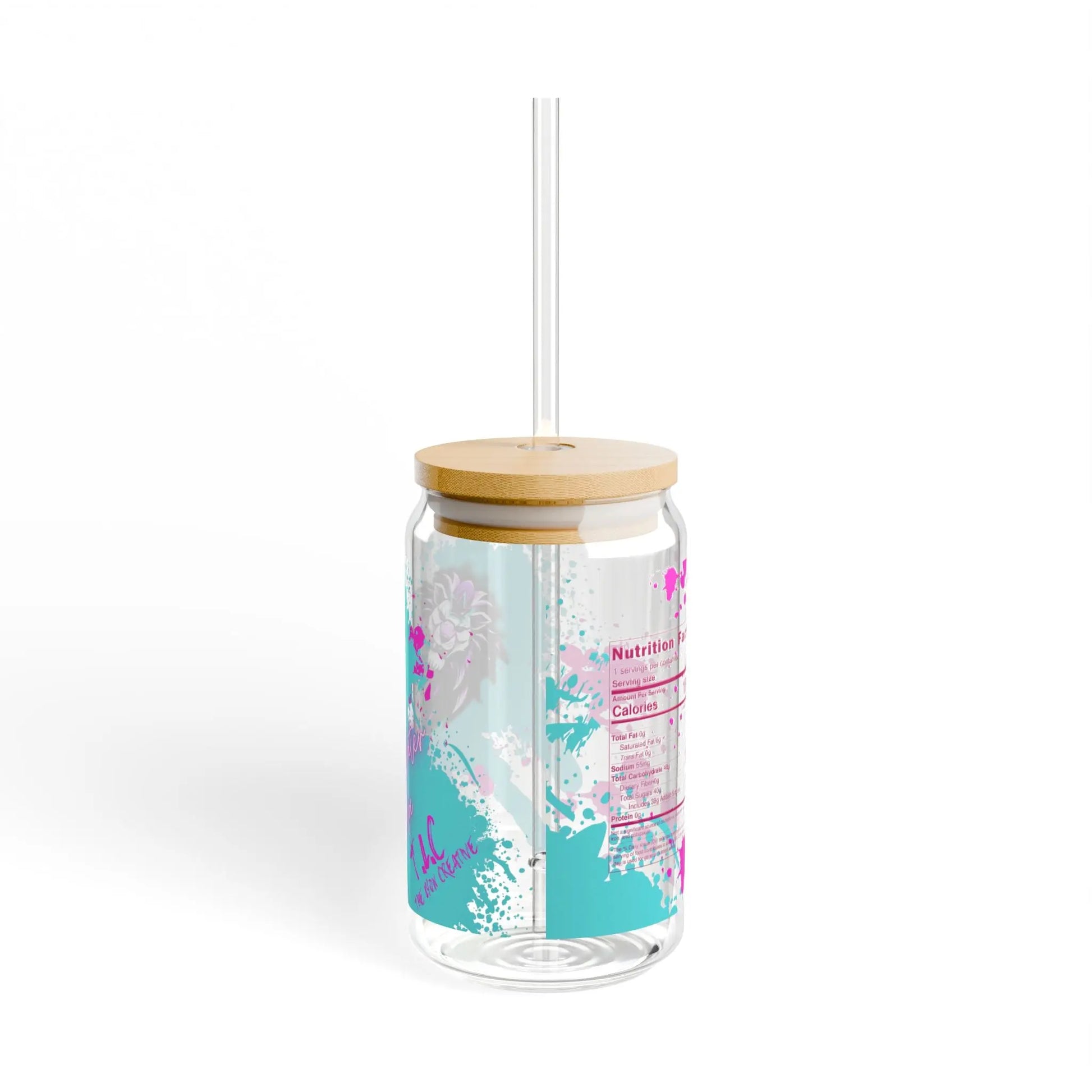 This 16oz Paint Water Soda Glass is crafted from clear tempered glass and comes with a BPA-free bamboo lid and straw. It features a vibrant pink tropical floral design along with a nutrition label, capturing a minimalist, summer-inspired aesthetic against a plain white background.