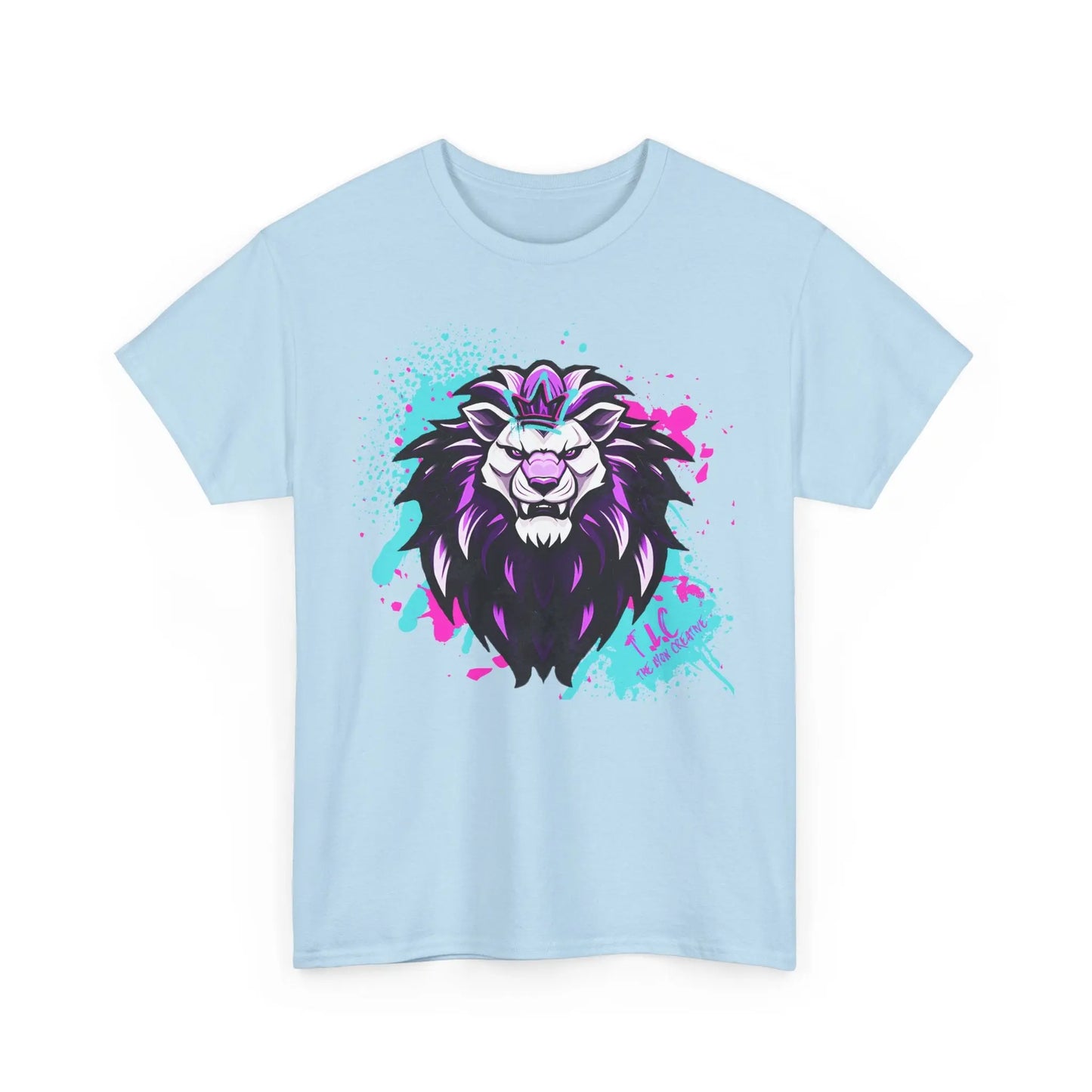 The Lyon T-shirt is a light blue garment crafted from 100% cotton, showcasing a stylized lion's head design. The artwork includes splashes of purple and turquoise paint, with the lion featuring a fierce, expressive look and a prominent black mane.