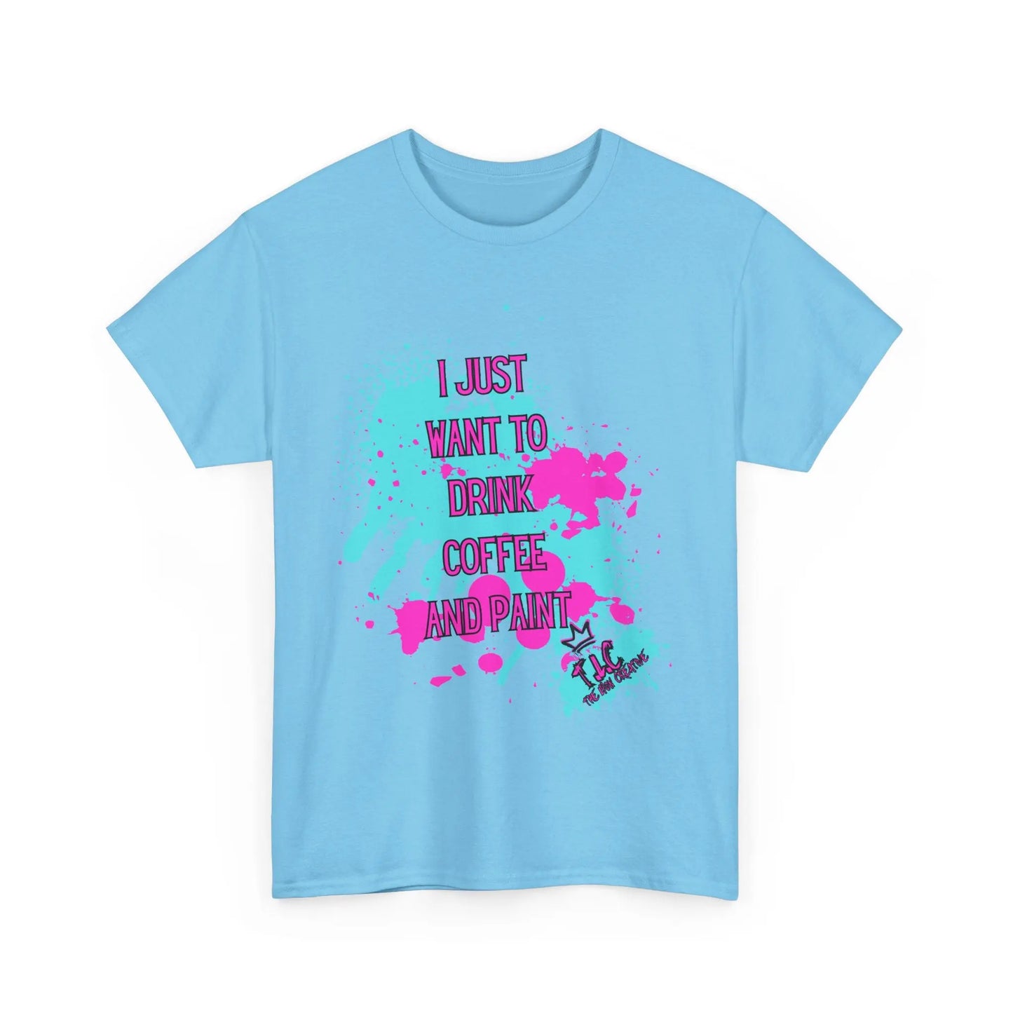 The "I Just Want to Drink Coffee T-shirt" is a sustainable light blue shirt crafted from 100% cotton, featuring colorful splatters alongside the text "I just want to drink coffee and paint" in pink and black. It is adorned with a small illustration of a person holding a paintbrush and coffee cup at the bottom.