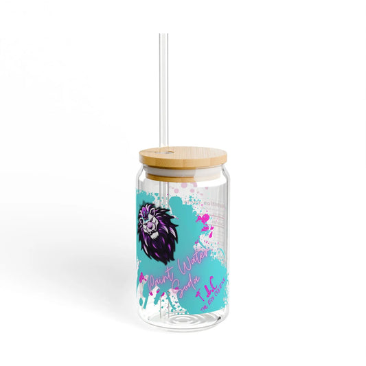 The Paint Water Soda Glass, 16oz, features a colorful lion design on clear tempered glass, complete with a bamboo lid and straw. The phrase "Pour Water for Tea" is elegantly displayed in a playful font, surrounded by splashes of blue and purple paint, highlighting the BPA-free design.